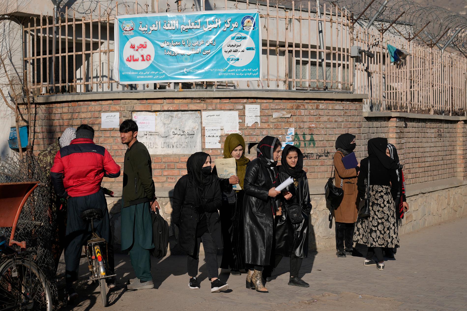 Armed guards stop female students in Kabul