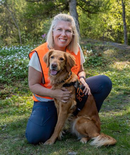 Oxygen To: Annette Kelsted with ID dog Alma.  Both of them have gone through many courses and trainings to become certified dog searchers. 