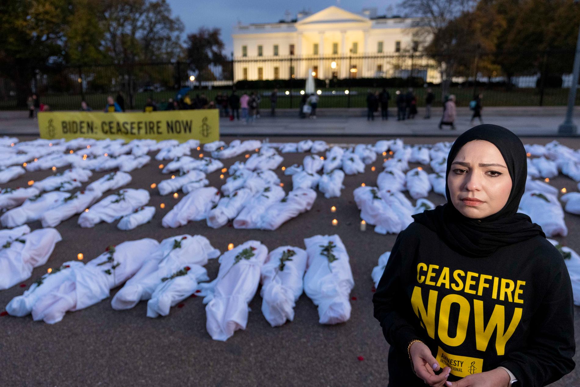 Body bags: Amnesty International placed fake body bags in front of the White House and called for a ceasefire in an action on November 15. 