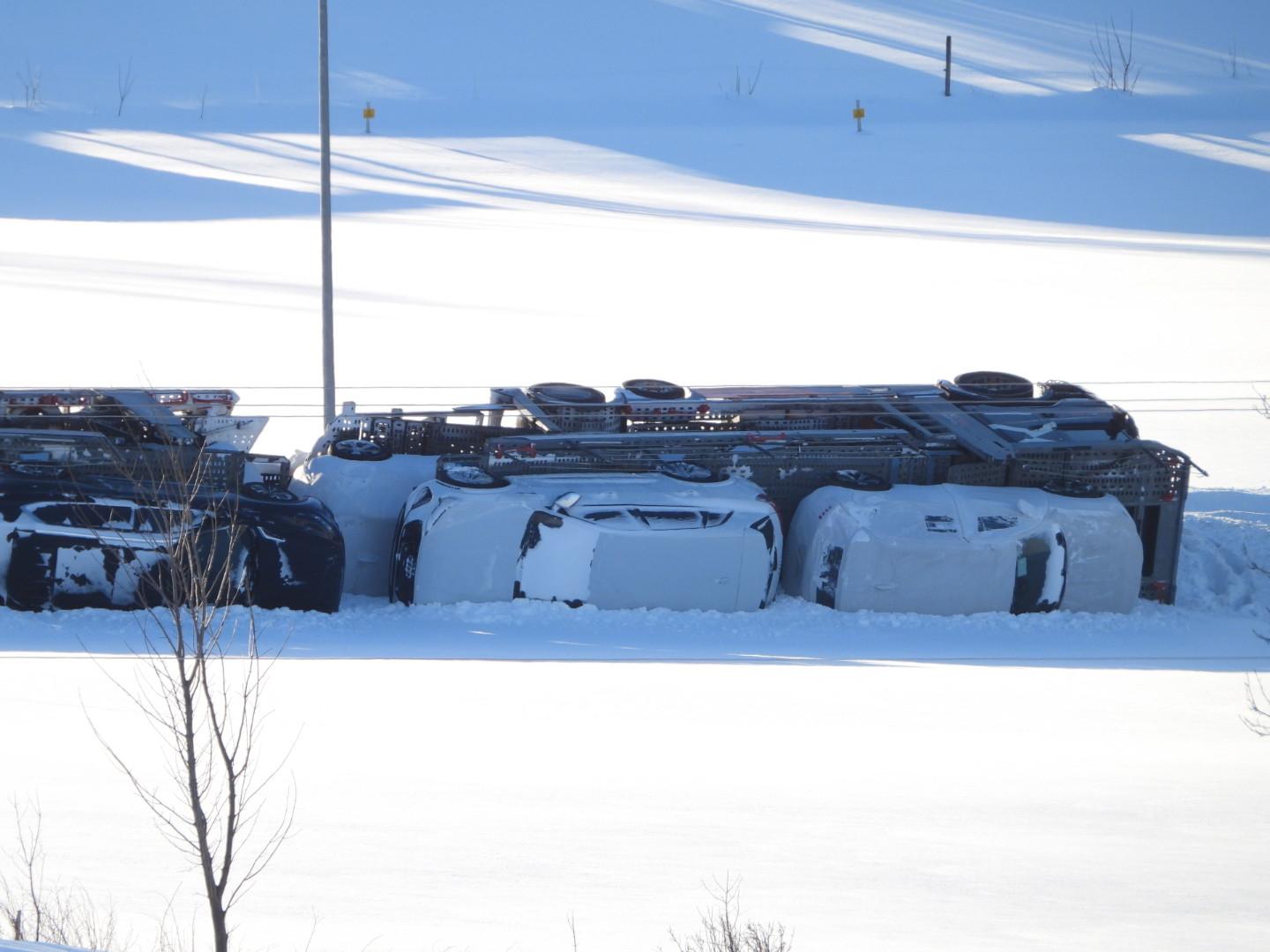 A wagon train loaded with cars overturned at Rauma