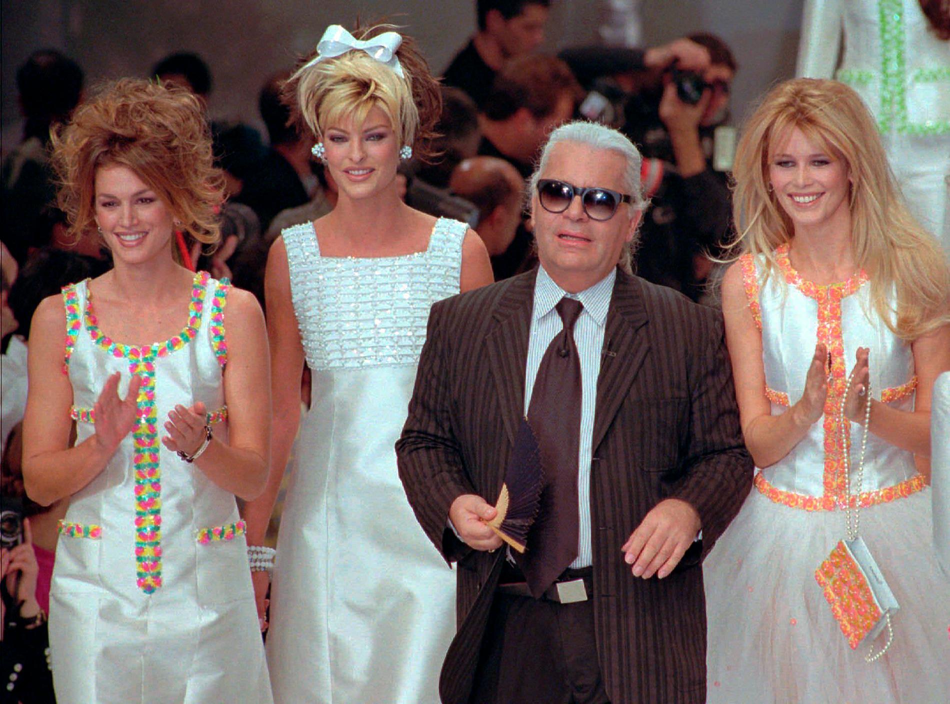 1996: The late Karl Lagerfeld flanked by some former supermodels Cindy Crawford, Linda Evangelista and Claudia Schiffer in New York.