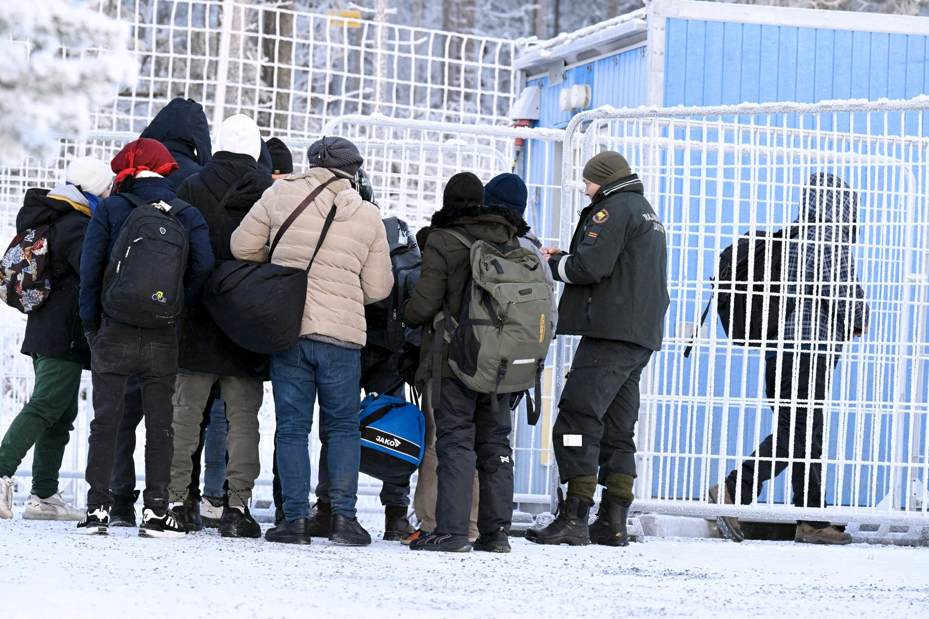 At the border: Migrants at the Finnish border on Tuesday.