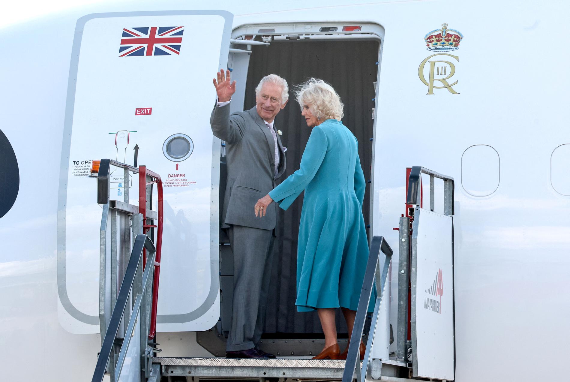 Departure: The royal couple waves to photographers from the plane at Bordeaux-Mérignac Airport on Friday evening.