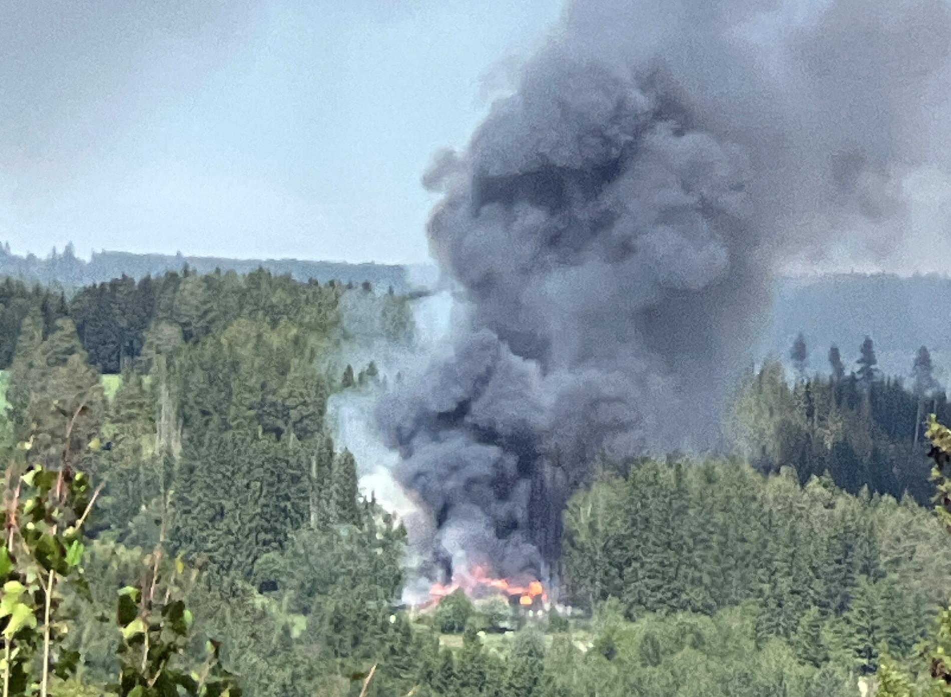 House fire spread to forest area – not contained