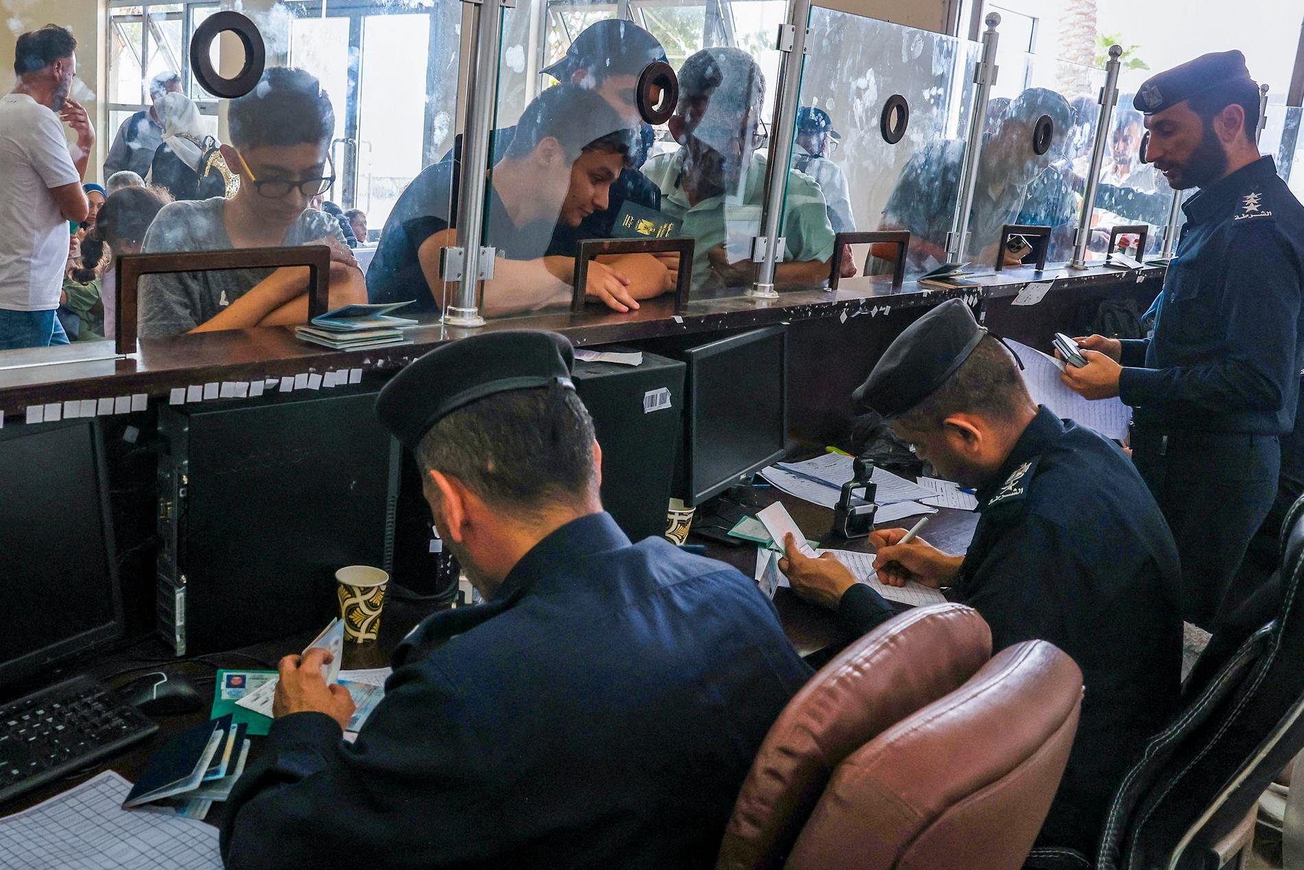 THE BORDER POST: Border guards check documents at the Rafah border crossing on the Gaza-Egypt border.