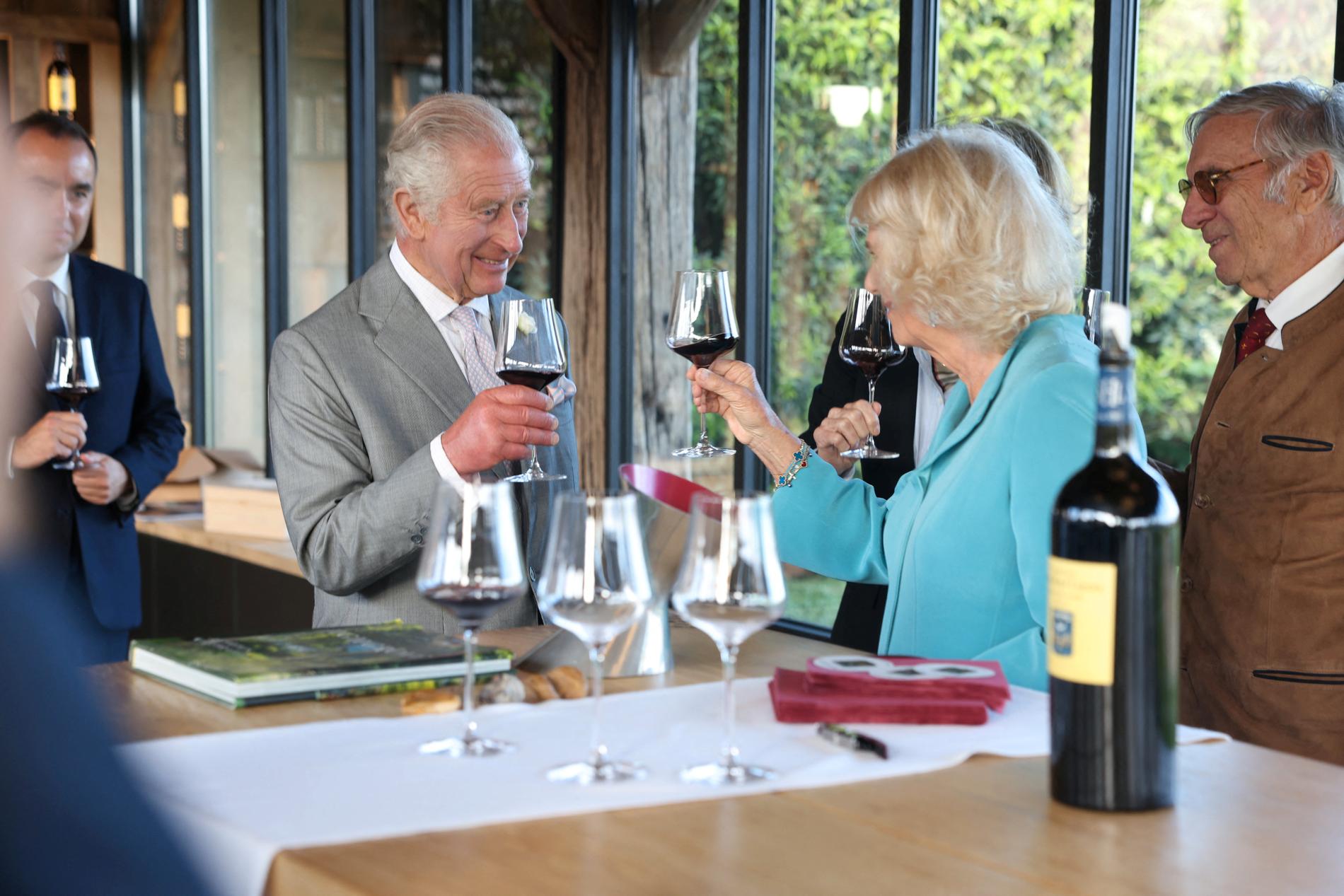 King Charles and Queen Camilla toast each other in France