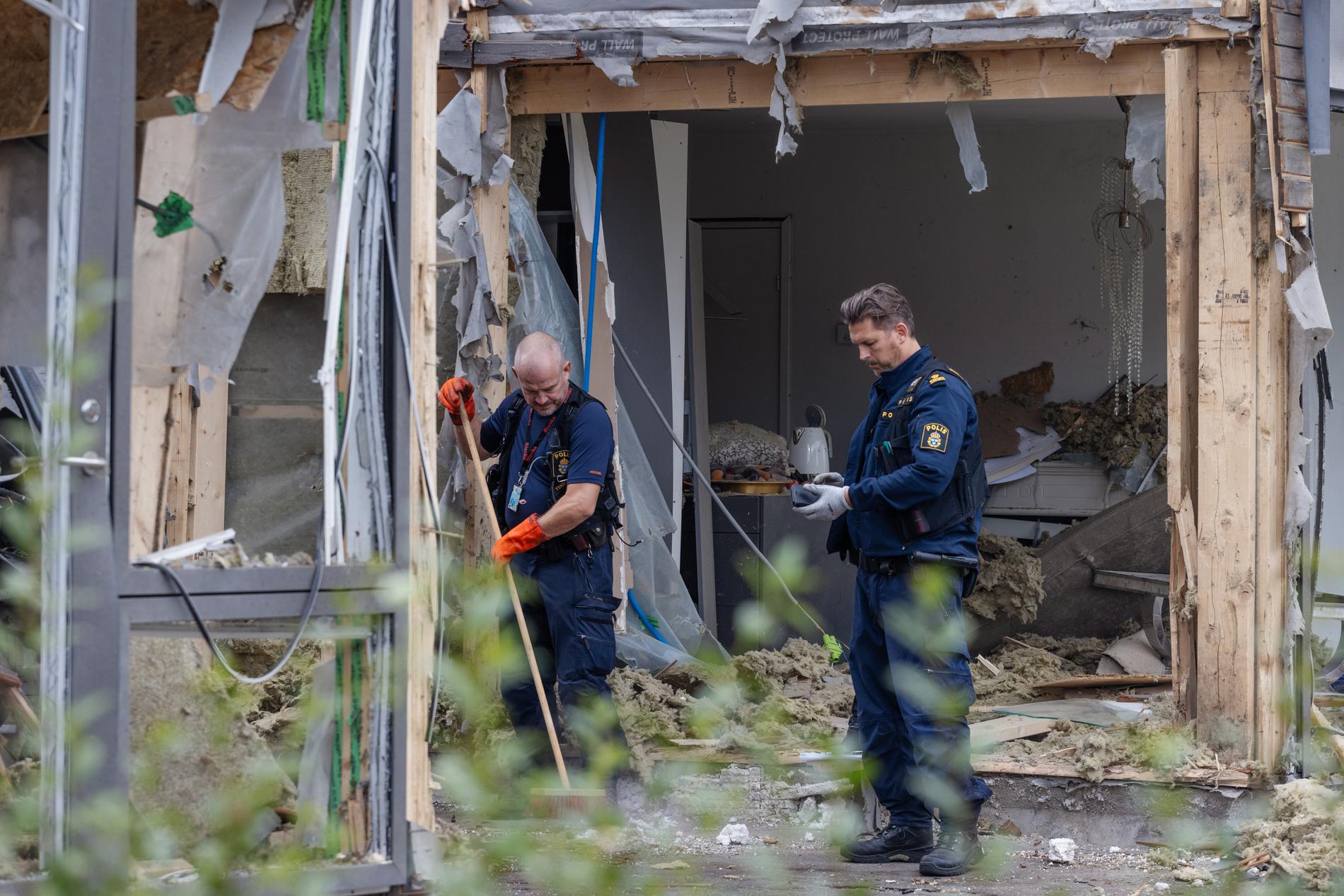 Title: “Swedish Crime Scene Technicians Investigate Bomb Explosion in Uppsala Neighborhood”