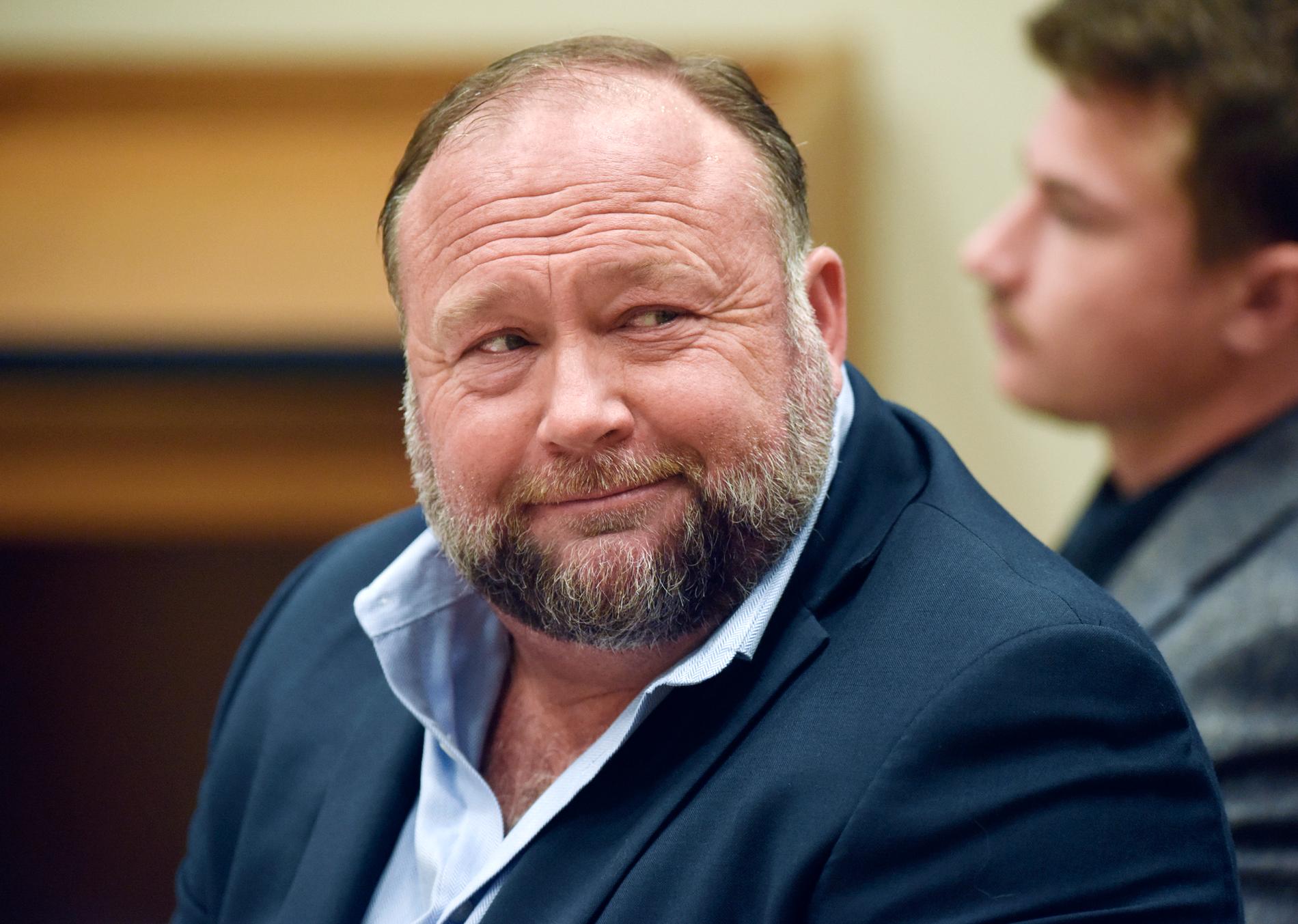 Conspiracy Theorist Alex Jones’ Media Company Faces Account Closure Amidst Bankruptcy Claims and Sandy Hook Shooting Controversy