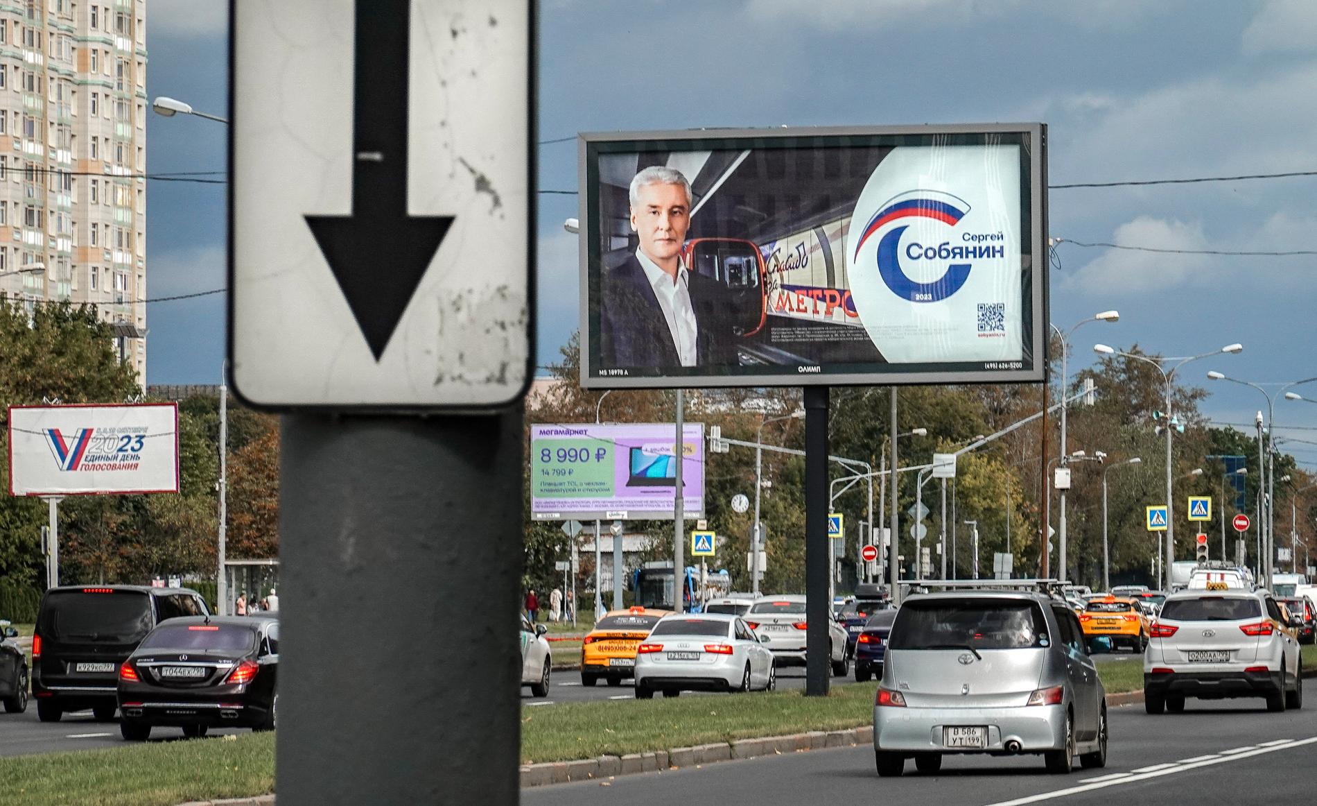 Cars pass by an election poster for the current mayor of Moscow, Sergei Sobyanin.  Elections are held on Friday, Saturday and Sunday.