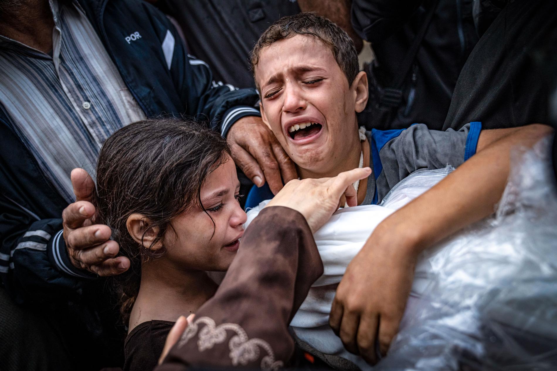 MOURNING: Palestinians mourn at a hospital in Khan Younis, Gaza.  The picture was taken on Tuesday this week. 