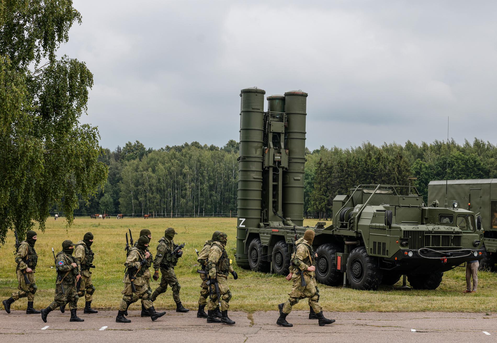 Russian soldiers walk in front of an S-300 missile system.  The photo was taken during a patriotic demonstration in the Moscow region on June 30, 2023.