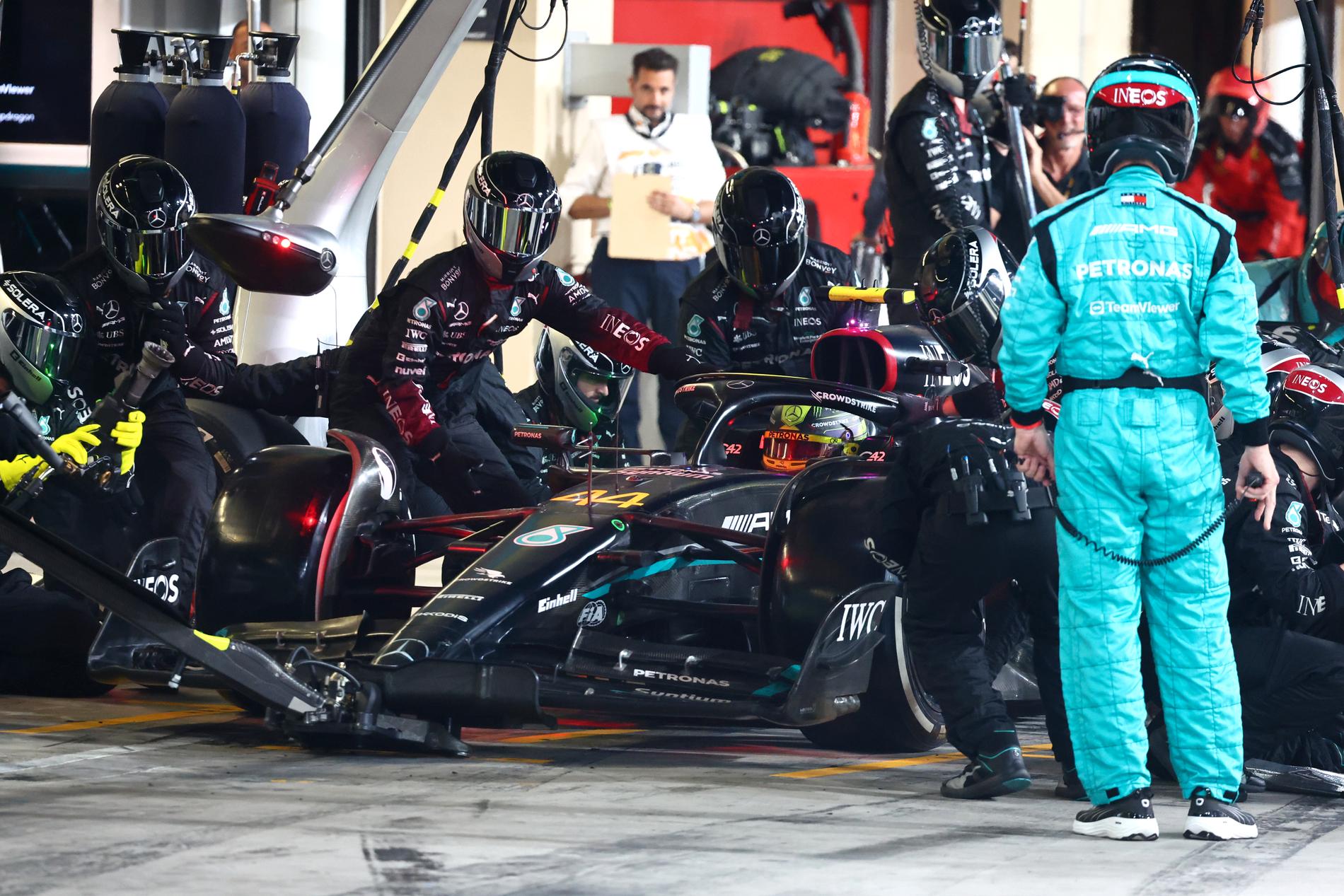 PIT STOP: Lewis Hamilton was photographed changing the wheel at the season finale in Abu Dhabi in November.
