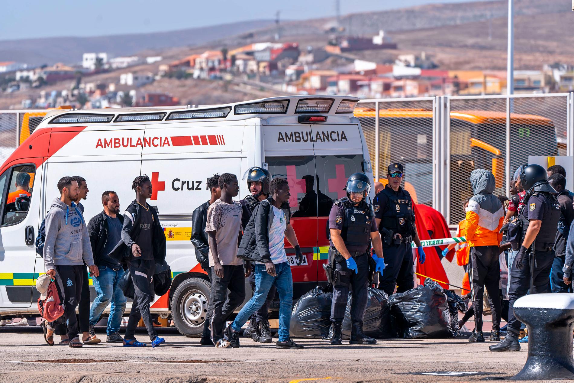 On the ground: People arrive in Puero del Rosario on the Canary island of Fuerteventura in Spain on Tuesday. 